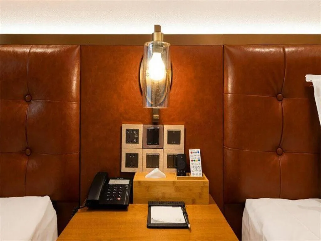 Bed in James Joyce Coffetel Shijiazhuang the Mixc Jinyuan Tower Airport Bus