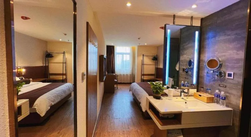 Bed in James Joyce Coffetel Shijiazhuang the Mixc Jinyuan Tower Airport Bus