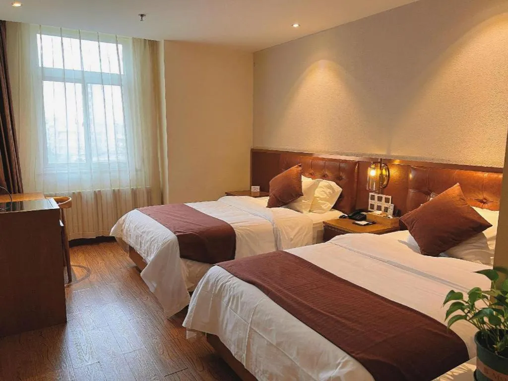 Bed in James Joyce Coffetel Shijiazhuang the Mixc Jinyuan Tower Airport Bus