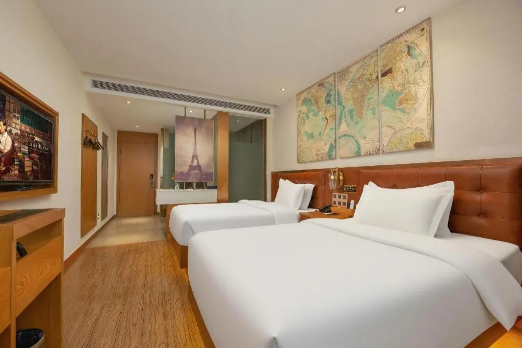 Bed in James Joyce Coffetel Shijiazhuang the Mixc Jinyuan Tower Airport Bus