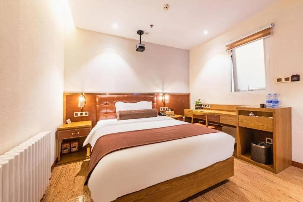 Bed in James Joyce Coffetel Shijiazhuang the Mixc Jinyuan Tower Airport Bus