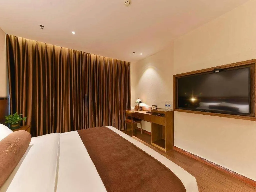 Bed in James Joyce Coffetel Shijiazhuang the Mixc Jinyuan Tower Airport Bus