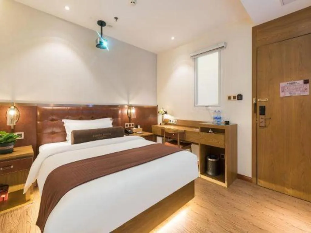 Bed in James Joyce Coffetel Shijiazhuang the Mixc Jinyuan Tower Airport Bus