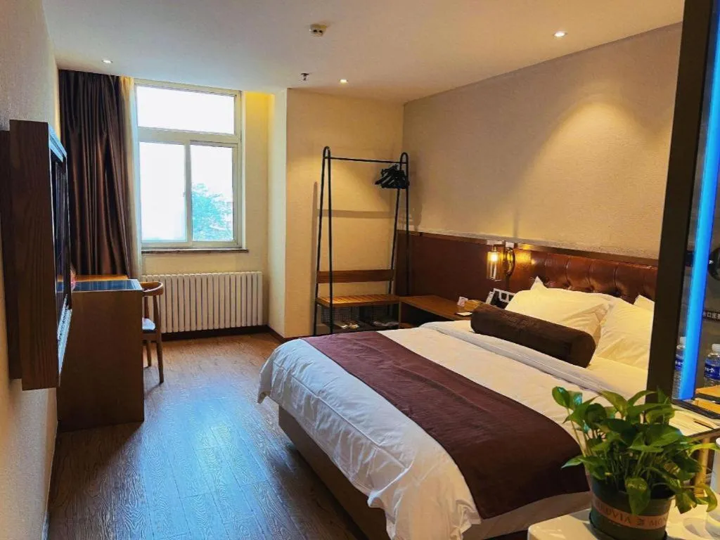 Bed in James Joyce Coffetel Shijiazhuang the Mixc Jinyuan Tower Airport Bus