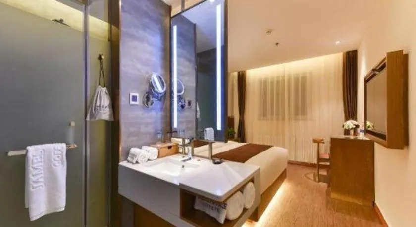 Bed in James Joyce Coffetel Shijiazhuang the Mixc Jinyuan Tower Airport Bus