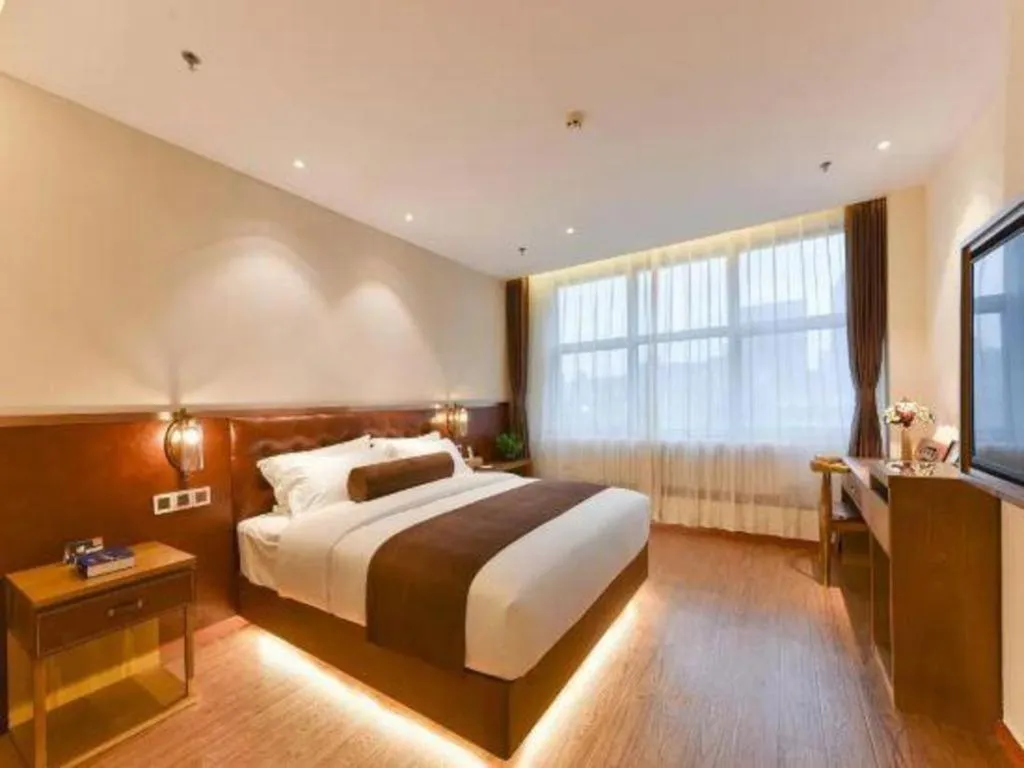 Bed in James Joyce Coffetel Shijiazhuang the Mixc Jinyuan Tower Airport Bus