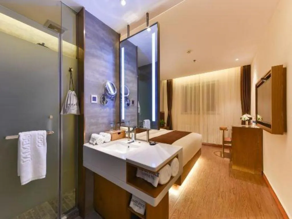 Bed in James Joyce Coffetel Shijiazhuang the Mixc Jinyuan Tower Airport Bus