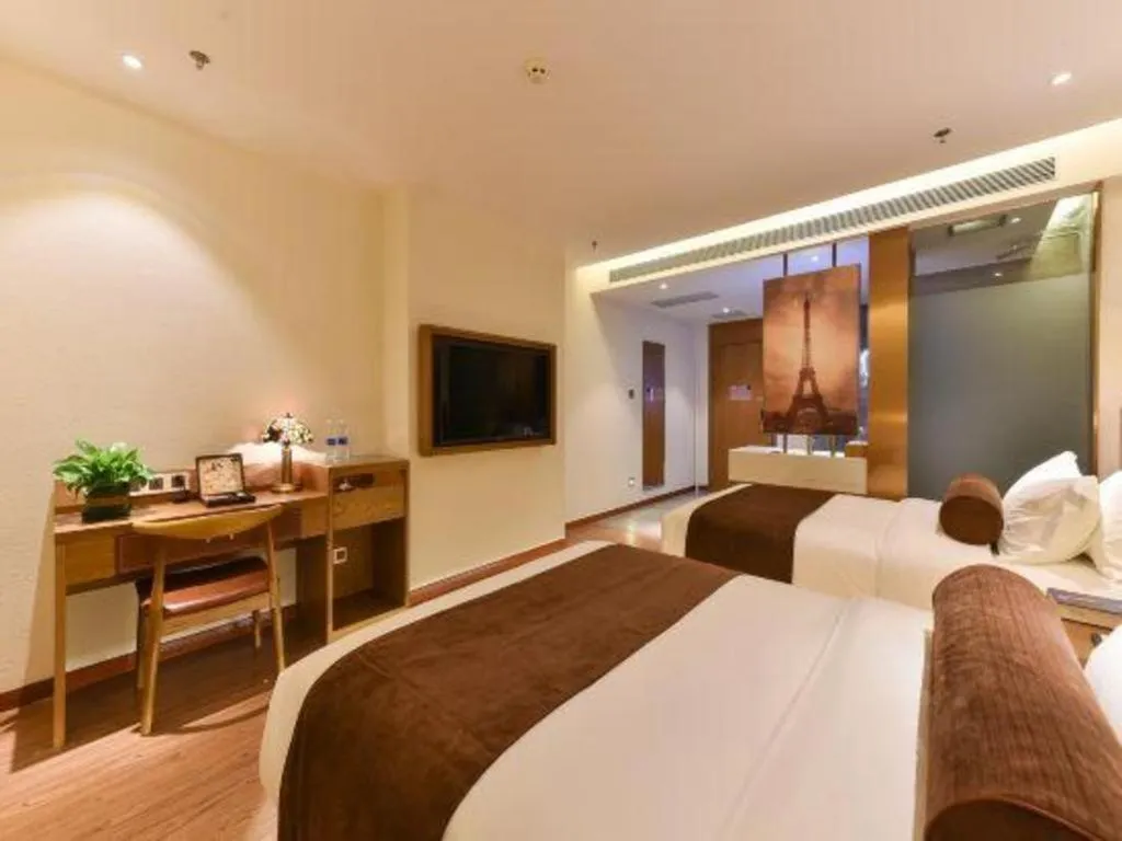 Bed in James Joyce Coffetel Shijiazhuang the Mixc Jinyuan Tower Airport Bus