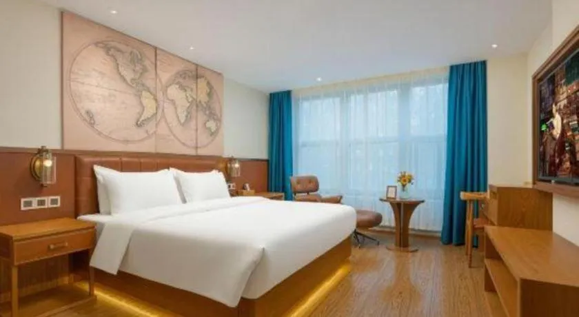 Bed in James Joyce Coffetel Shijiazhuang the Mixc Jinyuan Tower Airport Bus