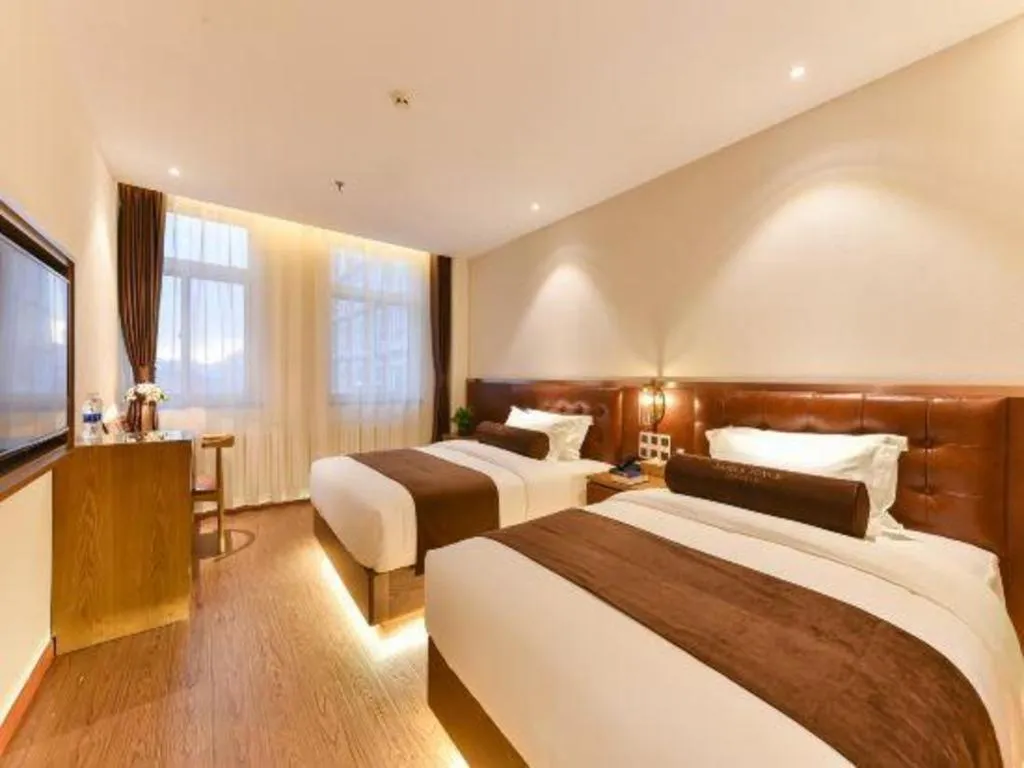 Bed in James Joyce Coffetel Shijiazhuang the Mixc Jinyuan Tower Airport Bus