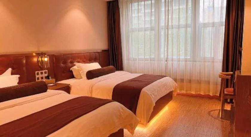 Bed in James Joyce Coffetel Shijiazhuang the Mixc Jinyuan Tower Airport Bus