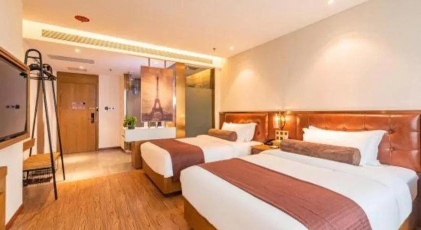 Bed in James Joyce Coffetel Shijiazhuang the Mixc Jinyuan Tower Airport Bus