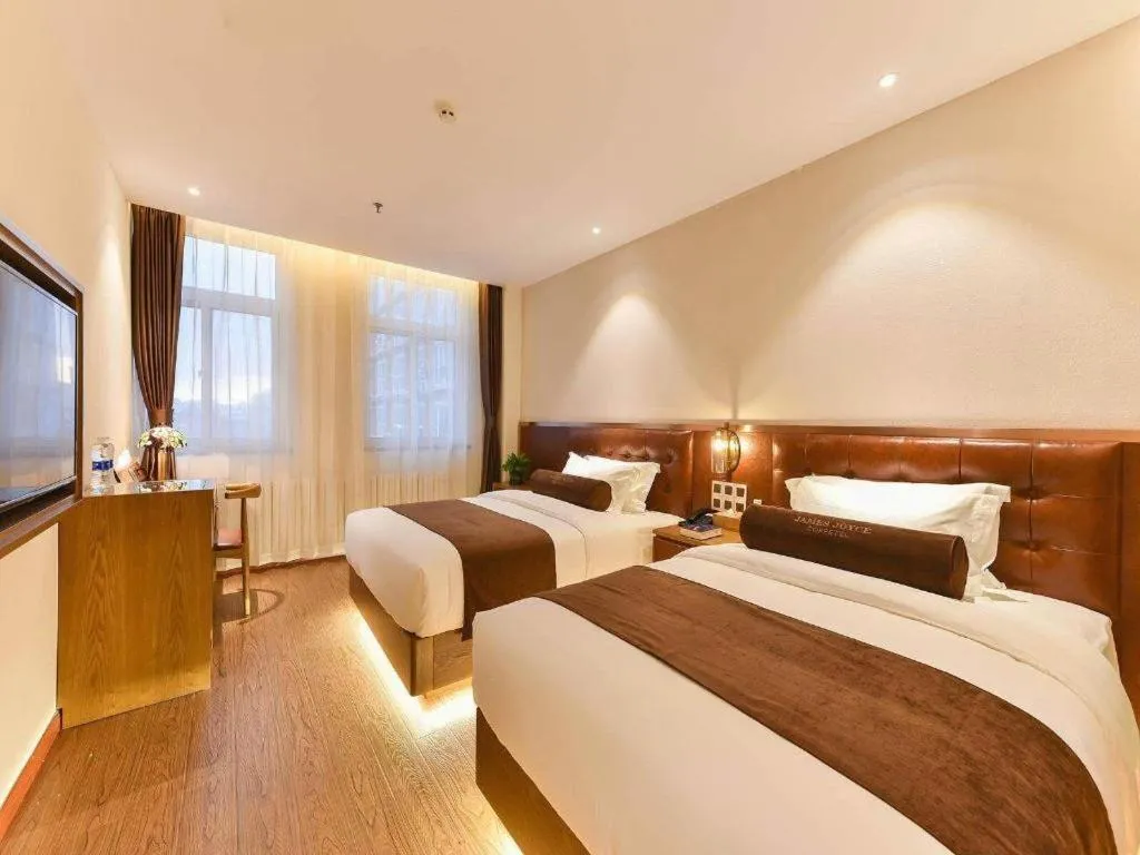 Bed in James Joyce Coffetel Shijiazhuang the Mixc Jinyuan Tower Airport Bus