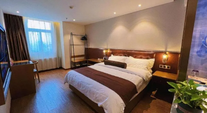 Bed in James Joyce Coffetel Shijiazhuang the Mixc Jinyuan Tower Airport Bus