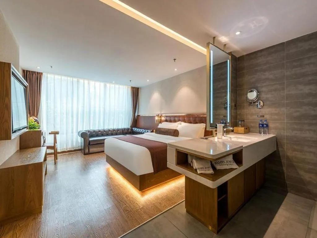 Bed in James Joyce Coffetel Shijiazhuang the Mixc Jinyuan Tower Airport Bus