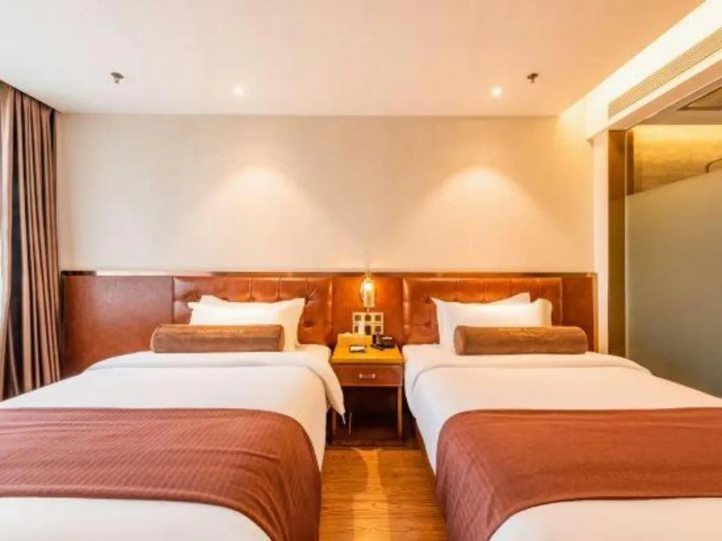 Bed in James Joyce Coffetel Shijiazhuang the Mixc Jinyuan Tower Airport Bus