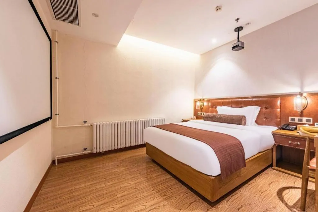 Bed in James Joyce Coffetel Shijiazhuang the Mixc Jinyuan Tower Airport Bus