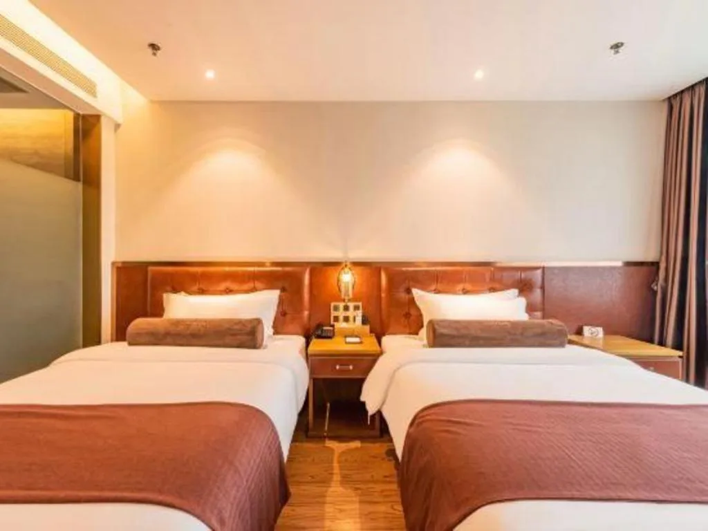 Bed in James Joyce Coffetel Shijiazhuang the Mixc Jinyuan Tower Airport Bus