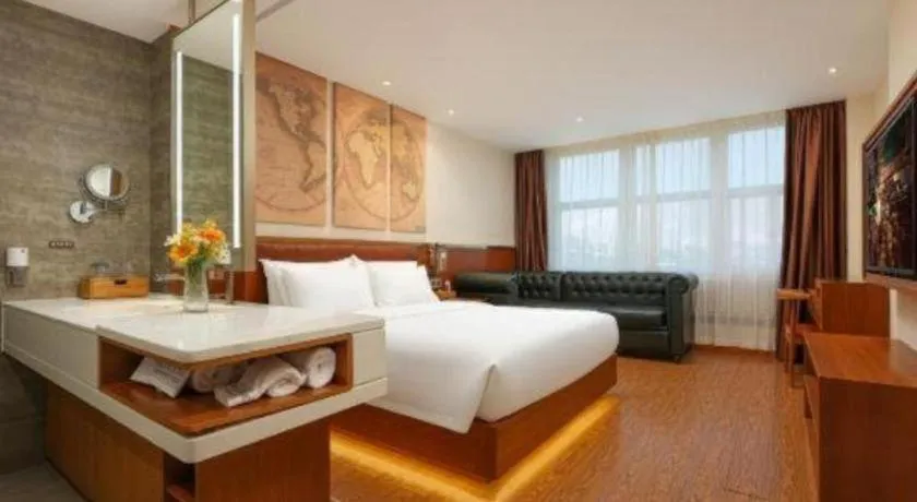 Bed in James Joyce Coffetel Shijiazhuang the Mixc Jinyuan Tower Airport Bus