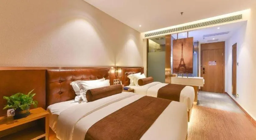 Bed in James Joyce Coffetel Shijiazhuang the Mixc Jinyuan Tower Airport Bus