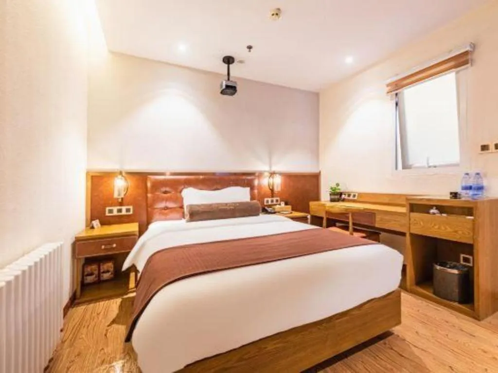 Bed in James Joyce Coffetel Shijiazhuang the Mixc Jinyuan Tower Airport Bus