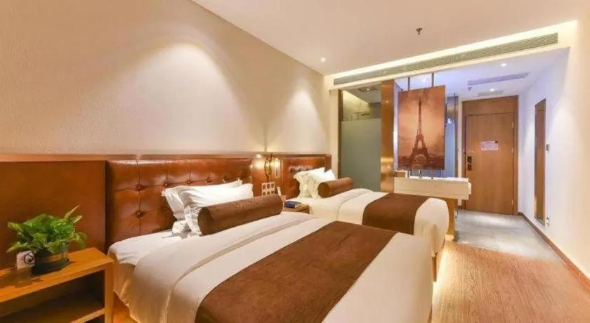 Bed in James Joyce Coffetel Shijiazhuang the Mixc Jinyuan Tower Airport Bus