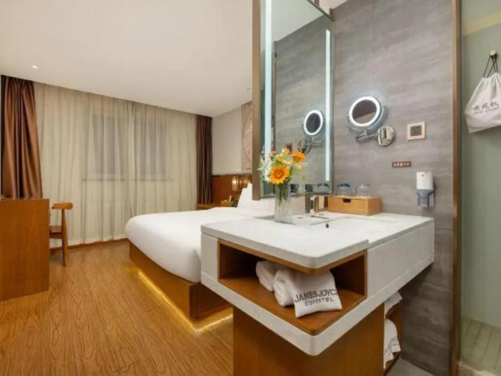 Bed in James Joyce Coffetel Shijiazhuang the Mixc Jinyuan Tower Airport Bus