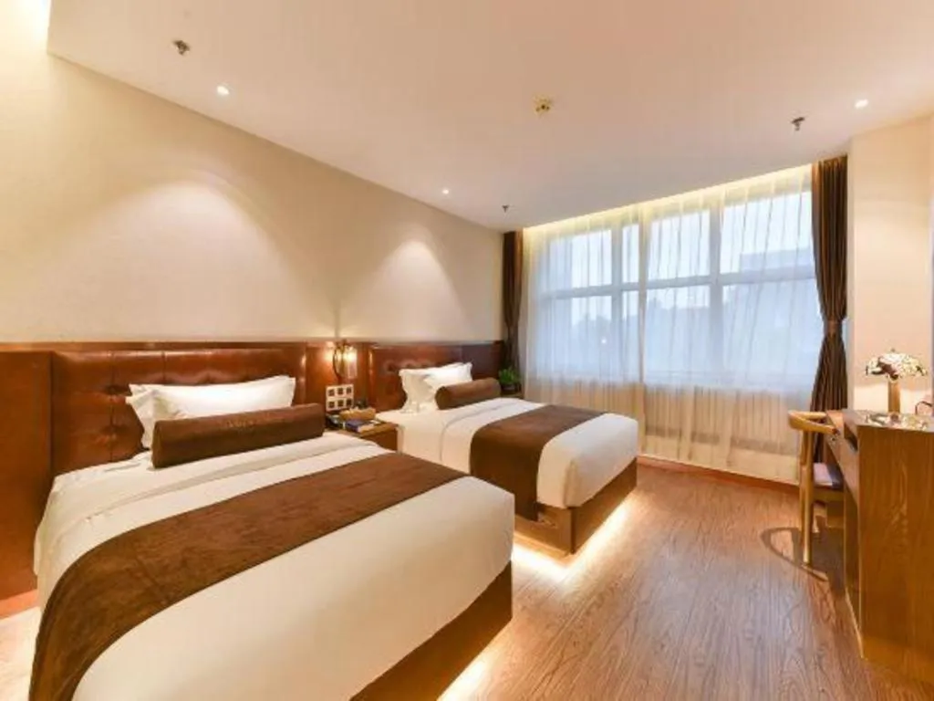 Bed in James Joyce Coffetel Shijiazhuang the Mixc Jinyuan Tower Airport Bus