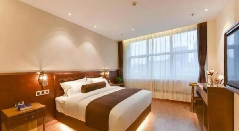 Bed in James Joyce Coffetel Shijiazhuang the Mixc Jinyuan Tower Airport Bus