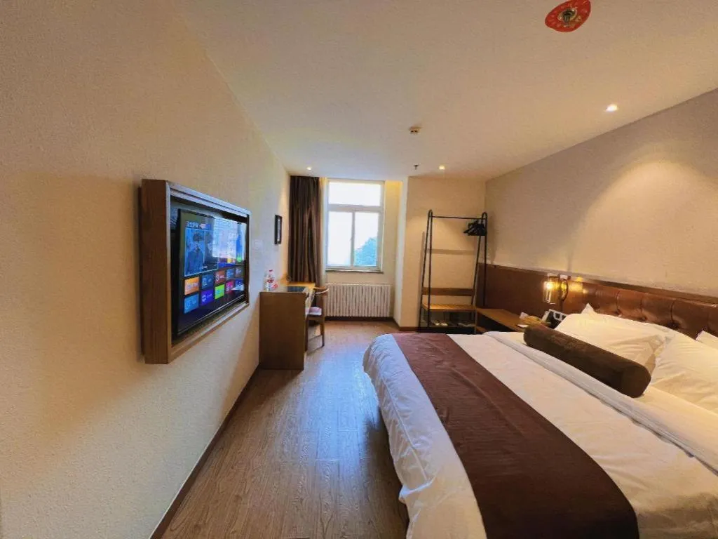 Bed in James Joyce Coffetel Shijiazhuang the Mixc Jinyuan Tower Airport Bus