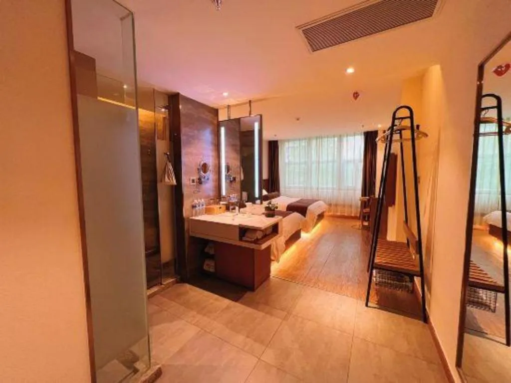 Bed in James Joyce Coffetel Shijiazhuang the Mixc Jinyuan Tower Airport Bus