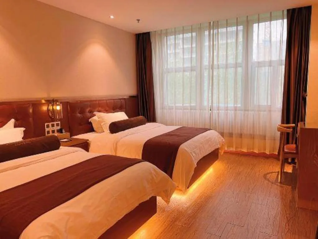 Bed in James Joyce Coffetel Shijiazhuang the Mixc Jinyuan Tower Airport Bus