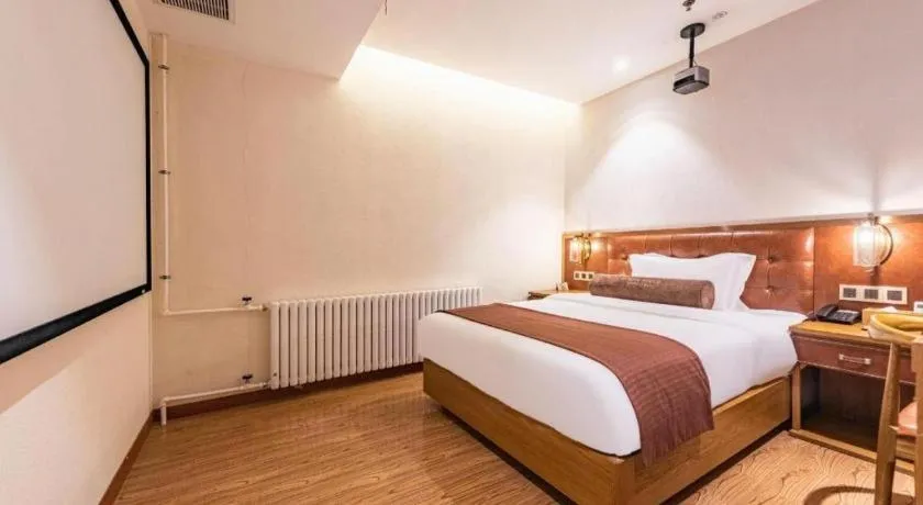 Bed in James Joyce Coffetel Shijiazhuang the Mixc Jinyuan Tower Airport Bus