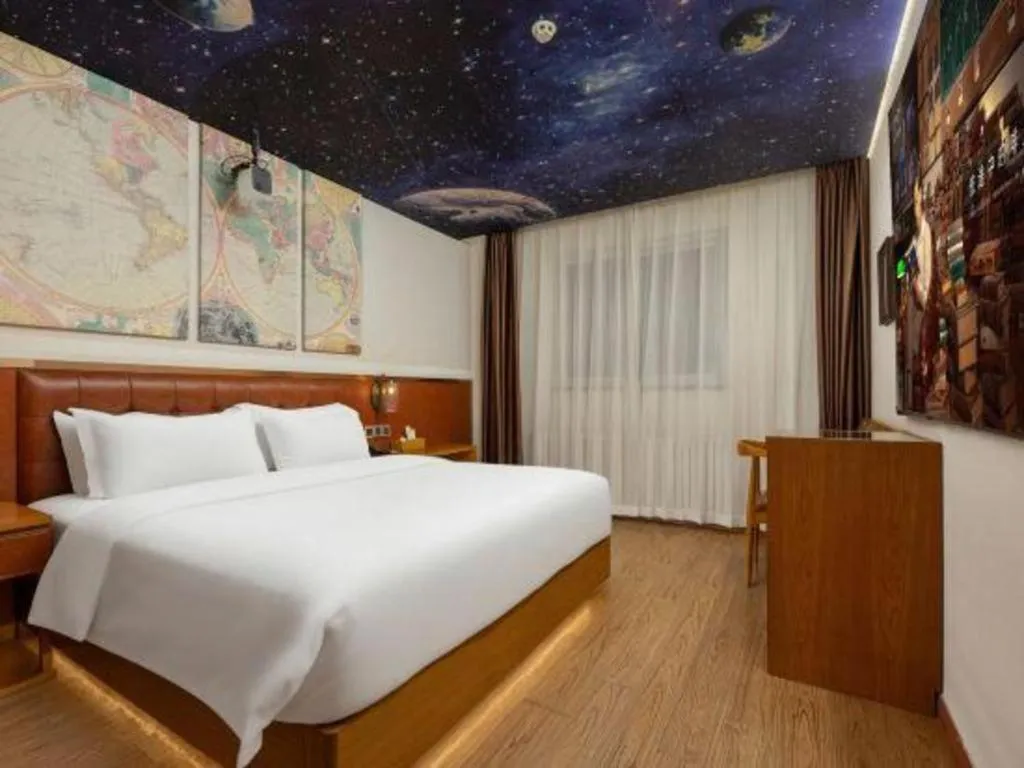 Bed in James Joyce Coffetel Shijiazhuang the Mixc Jinyuan Tower Airport Bus