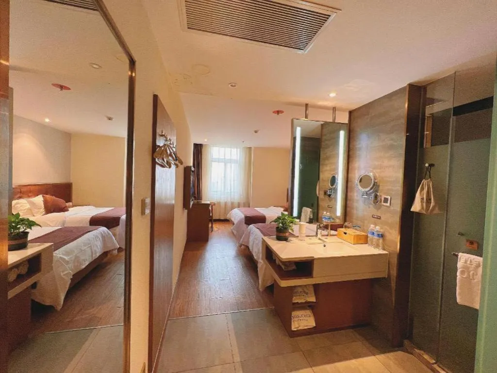 Bed in James Joyce Coffetel Shijiazhuang the Mixc Jinyuan Tower Airport Bus