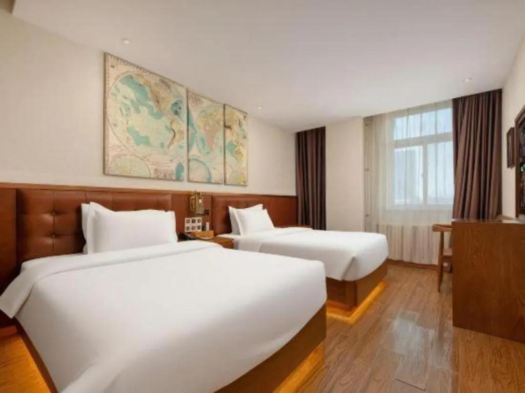 Bed in James Joyce Coffetel Shijiazhuang the Mixc Jinyuan Tower Airport Bus