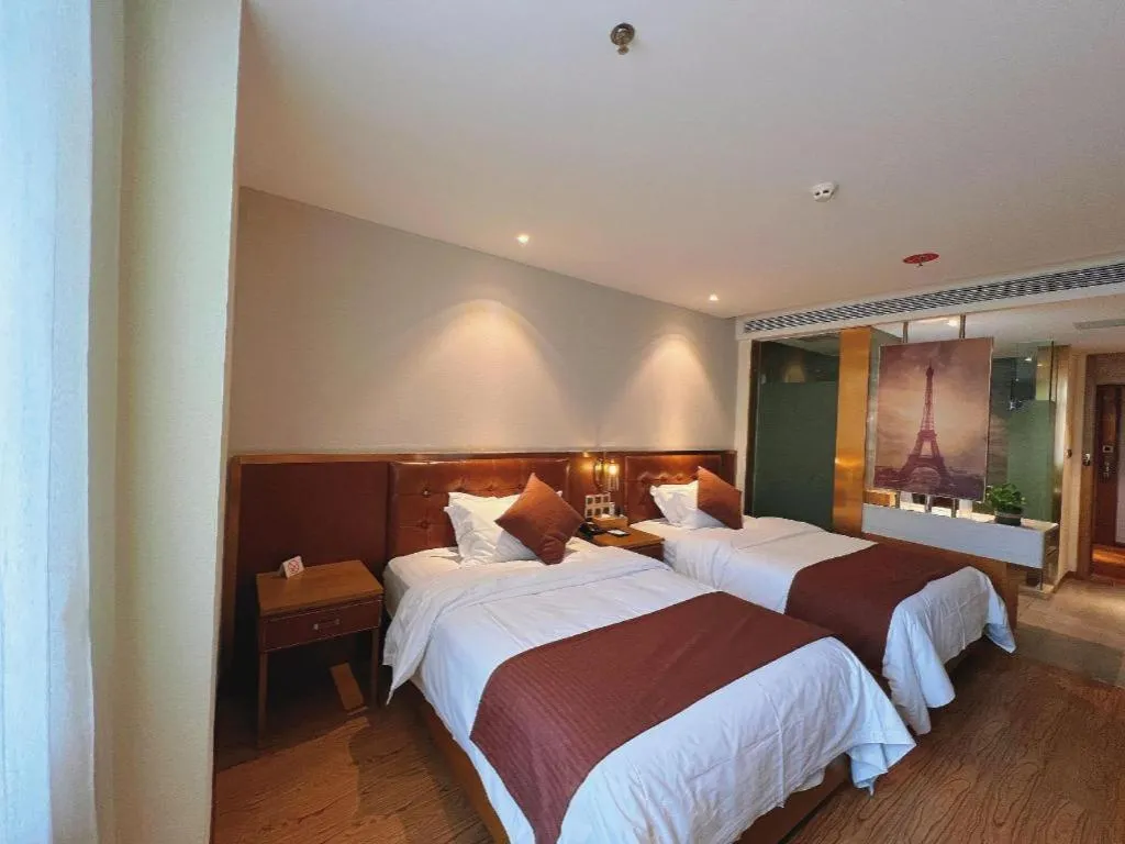 Bed in James Joyce Coffetel Shijiazhuang the Mixc Jinyuan Tower Airport Bus
