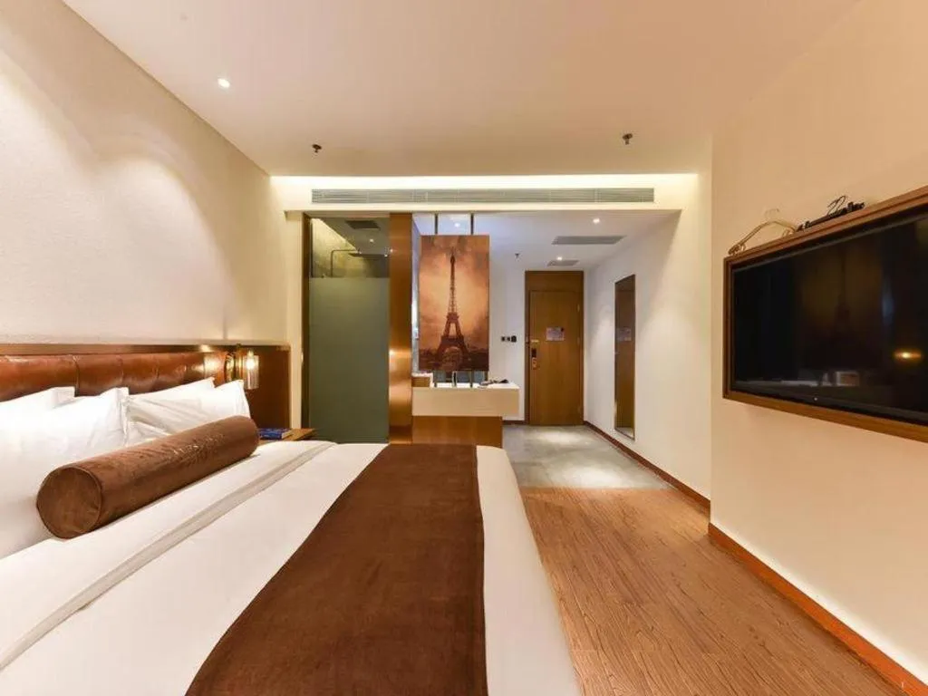 Bed in James Joyce Coffetel Shijiazhuang the Mixc Jinyuan Tower Airport Bus