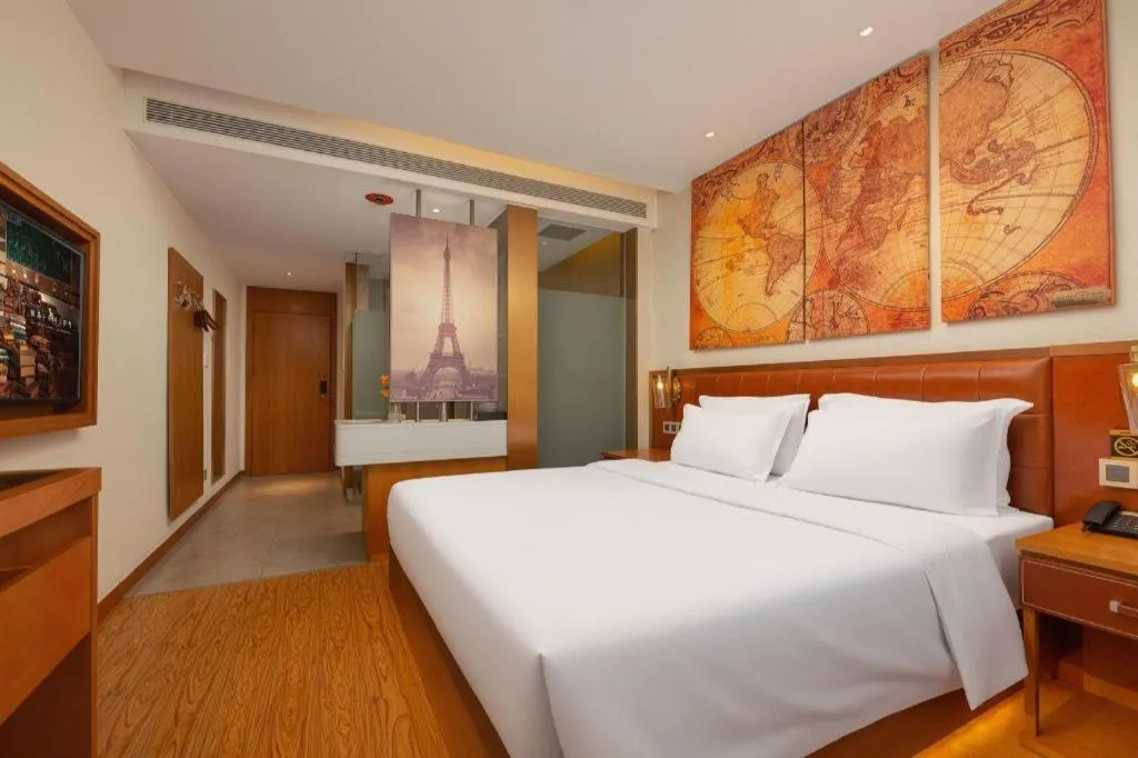 Bed in James Joyce Coffetel Shijiazhuang the Mixc Jinyuan Tower Airport Bus