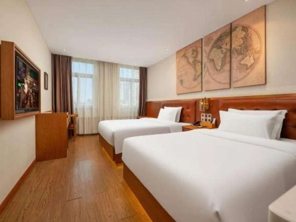Bed in James Joyce Coffetel Shijiazhuang the Mixc Jinyuan Tower Airport Bus