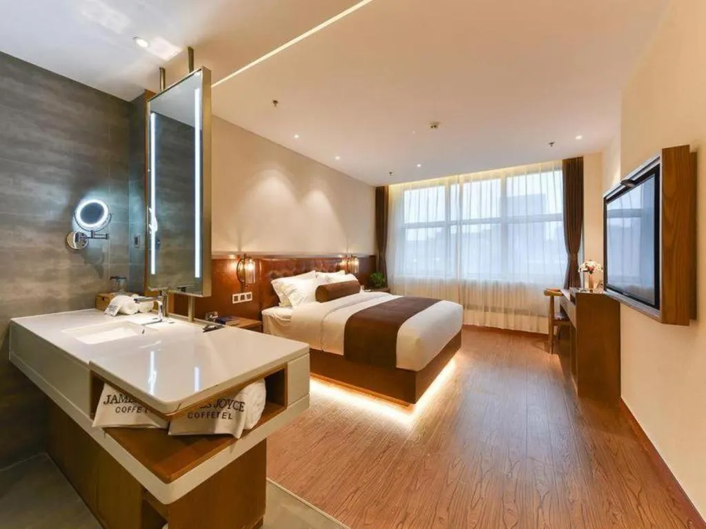 Bed in James Joyce Coffetel Shijiazhuang the Mixc Jinyuan Tower Airport Bus