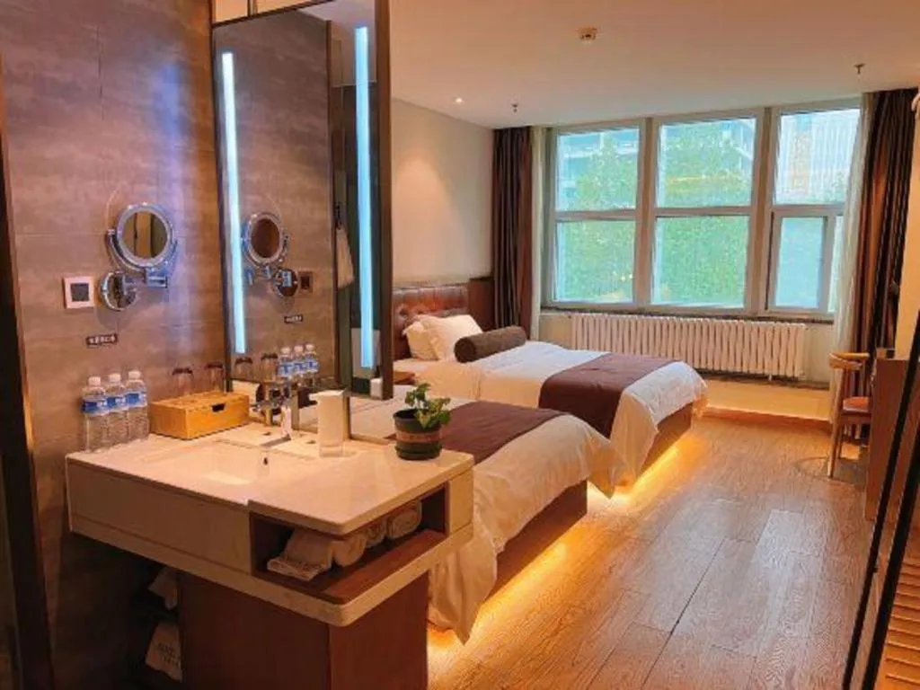 Bed in James Joyce Coffetel Shijiazhuang the Mixc Jinyuan Tower Airport Bus