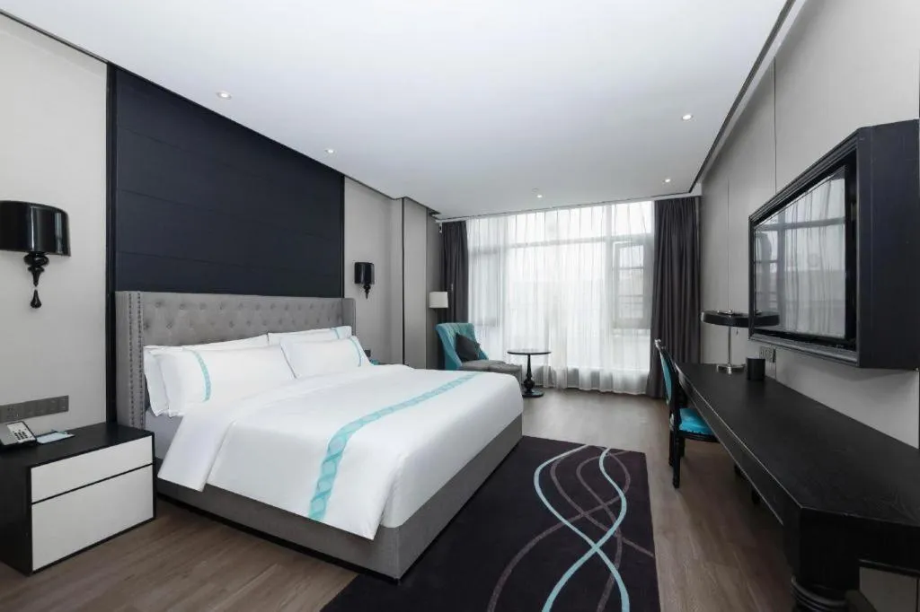 Bed in Xana Hotelle Luzhou High-Speed Railway Station Trading Market Passenger Terminal