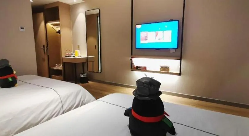 Bed in Magnotel Tongxiang Shimao Center