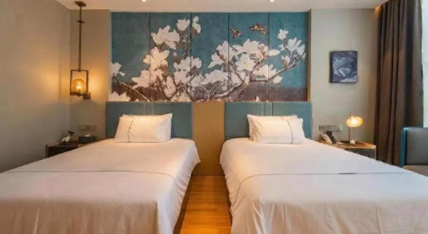 Bed in Magnotel Tongxiang Shimao Center