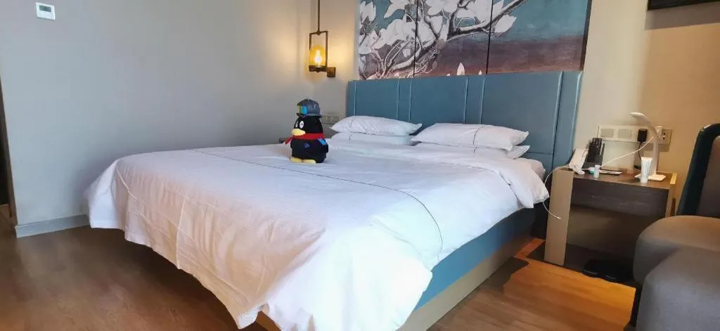 Bed in Magnotel Tongxiang Shimao Center