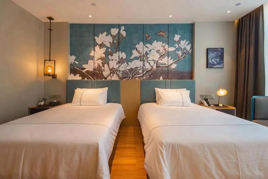 Bed in Magnotel Tongxiang Shimao Center