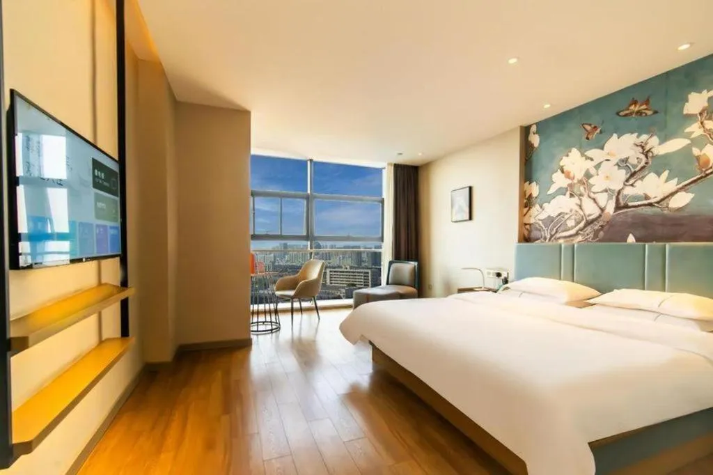 Bed in Magnotel Tongxiang Shimao Center