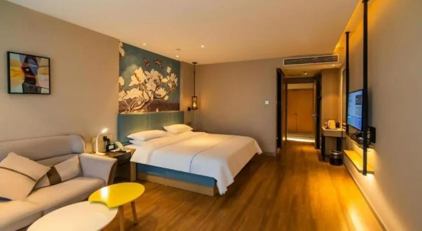 Bed in Magnotel Tongxiang Shimao Center