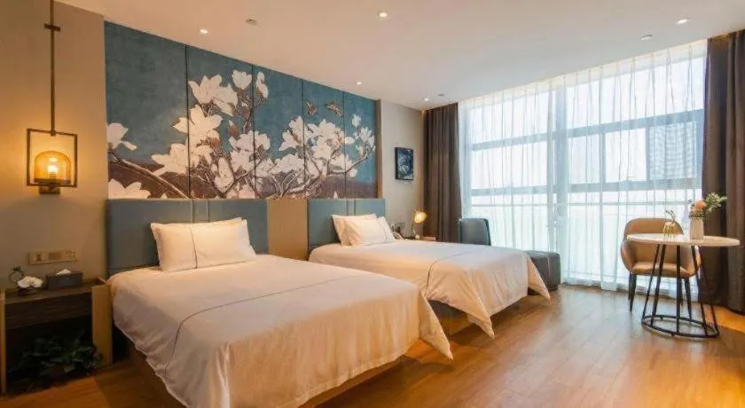 Bed in Magnotel Tongxiang Shimao Center